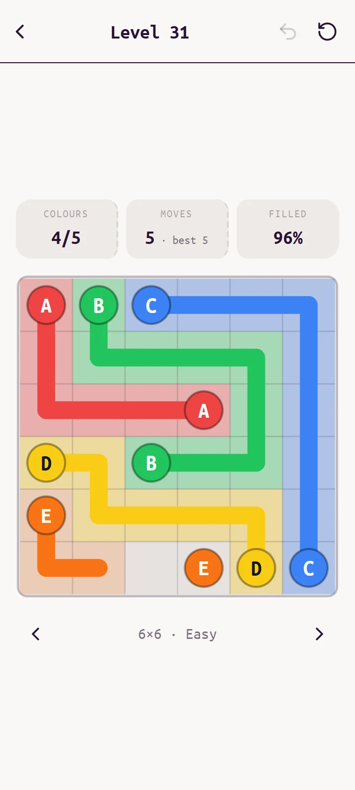 A 6×6 level with the light Cupcake theme and letters on the dots